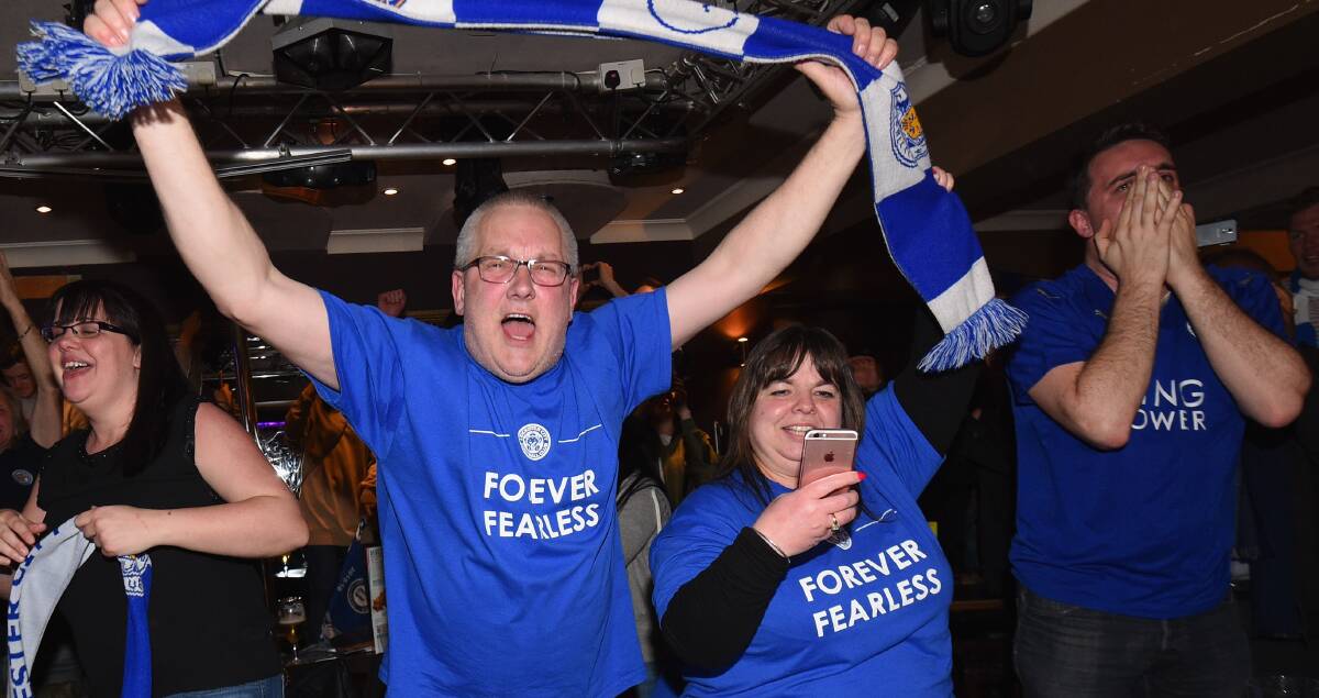 FAIRYTALE: Leicester City fans celebrate as their team becomes Premier League champions. 
Picture: Ross Kinnaird/Getty Images