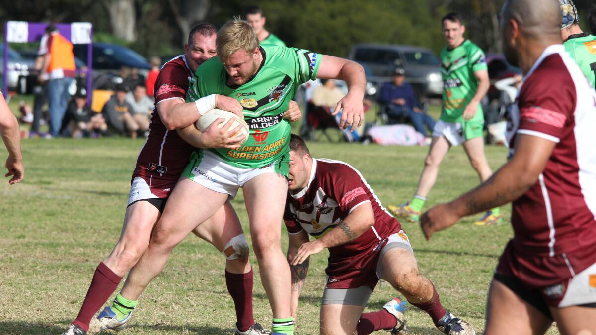 Leeton Green Rhys Wilesmith is brought down by the Yanco-Wamoon defence last week. Picture: Ron Arel