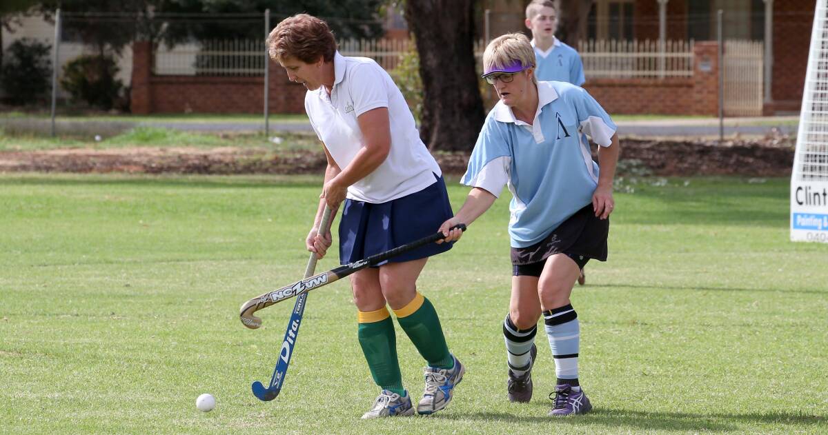 BIG GAME: Griffith Retirement Estate's Lyn Mason, pictured in the white duelling with Pinnacle's Jackie Twigg, will take on Easts Flavourtech in a top of the table clash.