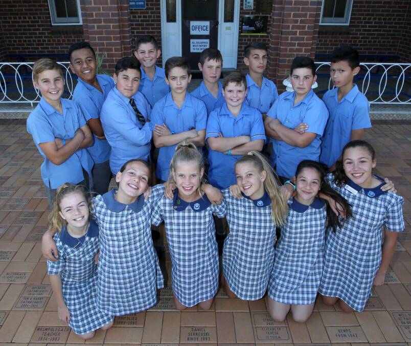 BIG DAY: The group of students from St Patrick's Catholic Primary School show their excitement about the trip to Canberra. Picture: Anthony Stipo