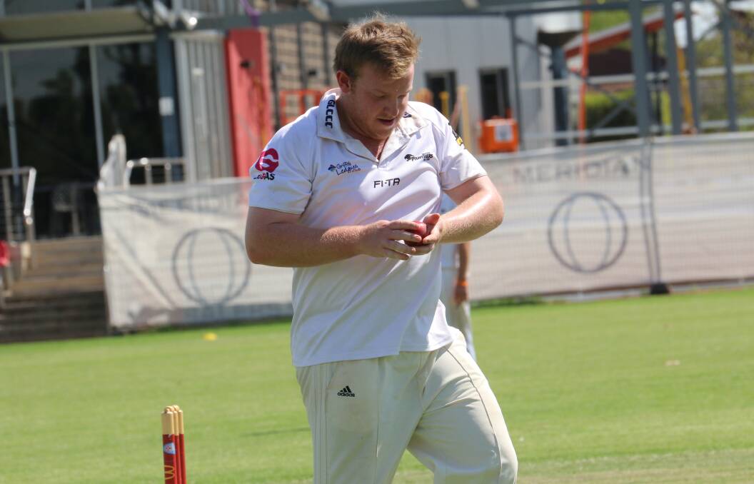KEY PLAYER: Jimmy Binks, pictured shining the ball on Saturday, scored a half-century for Leagues Club. PHOTO: Ben Jaffrey