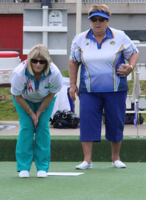 FOCUS: Marlene O'Connell eyes her bowl as Patti Wakeman watches on.