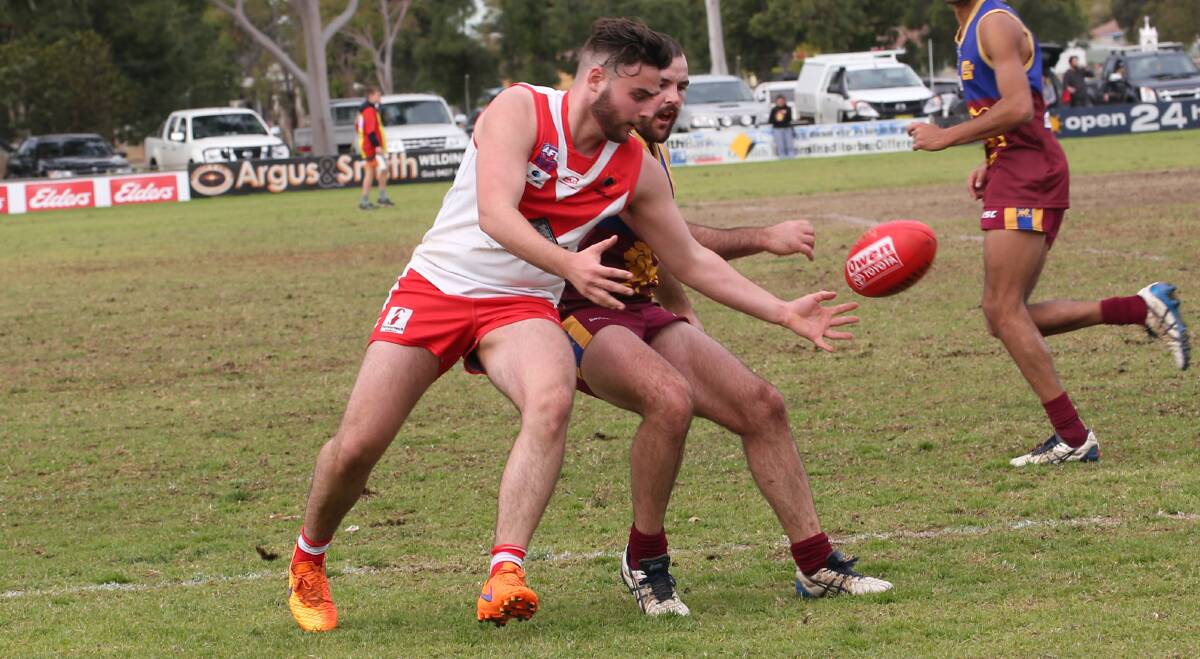 IN THE HUNT: Tyler Bruns clashes for a ball against a Ganmain-Grong Grong-Matong player last Sunday. Picture: Anthony Stipo