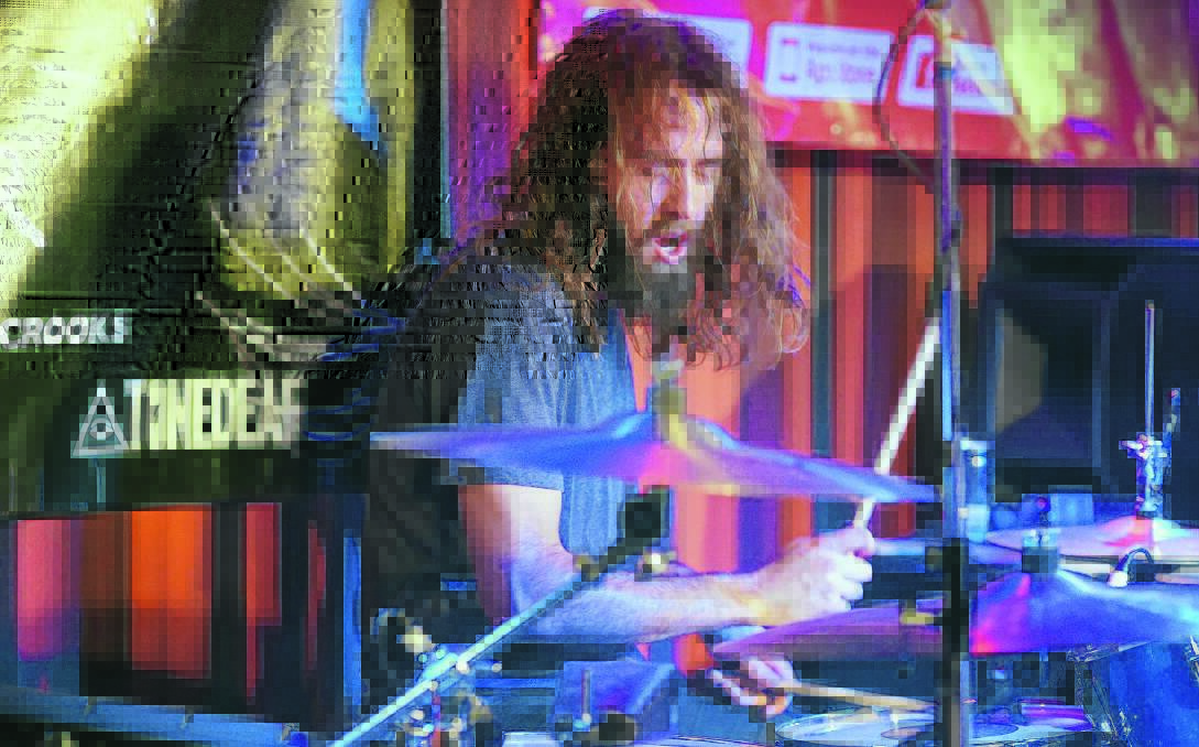 BEAT THE DRUM: Damien Jones on stage with Lepers and Crooks, who are set to hit Griffith in March. Picture: Supplied.