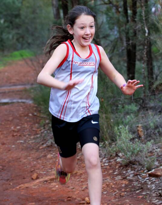 SLIPPERY: Isabella Salmon tackles the muddy terrain at Scenic Hill. Picture: Anthony Stipo.