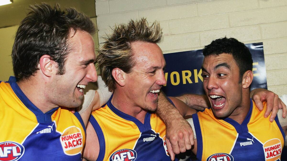 HITTING THE REGION: Daniel Kerr (right) with Chris Judd and Daniel Chick celebrate a win back in 2006. PHOTO: Hamish Blair/Getty Images