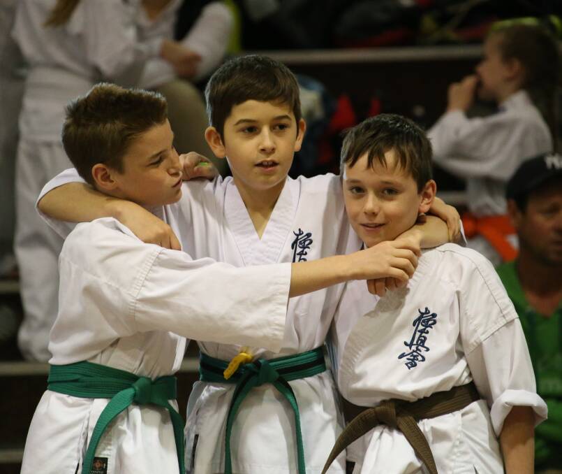 GOOD TIMES: Enzo Nolan, Arnold Luppi and James Nase have a ball at the Riverina Kyokushin Karate Interclub Challenge. Picture: Anthony Stipo