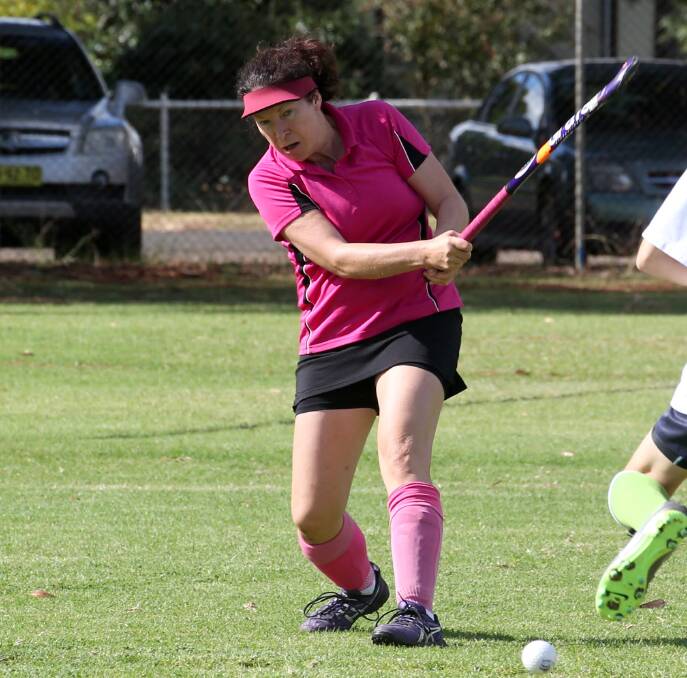 POWER: Griffith Bricks' Toni Howard clears a ball up the field against Griffith Retirement. Picture: Anthony Stipo