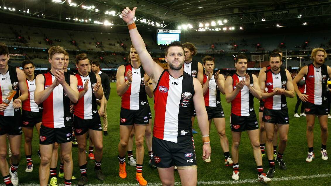 BARELLAN BOUND: Adam Schneider is farewelled by his St Kilda teammates at Etihad Stadium last year after calling time on his AFL career. Picture: Getty Images