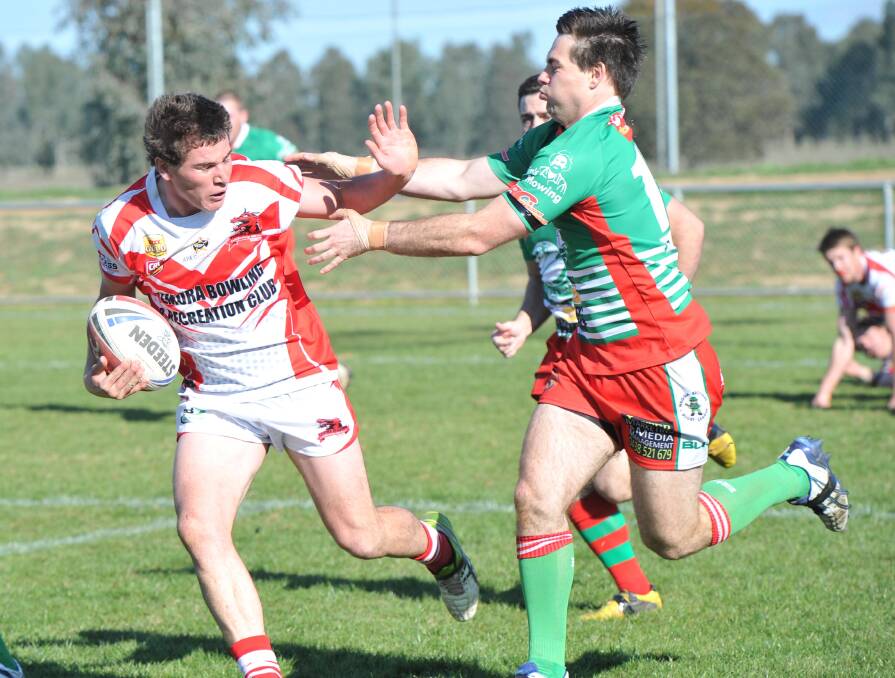 SIGNING: Sam Kerry, pictured in red and white playing for Temora, will pull the boots on for West Wyalong in the Group 20 2015 season. Picture: Daily Advertiser