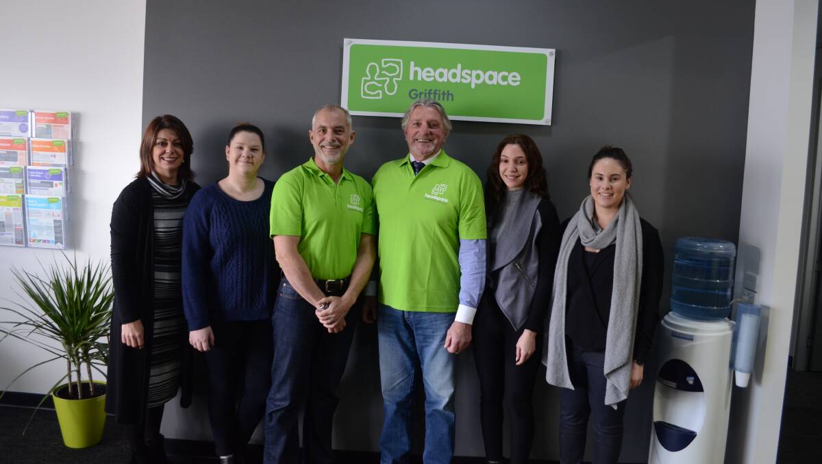 MPHN SEO James Lamerton and Centacare South West NSW CEO Paul Jensen with the staff from headspace in Griffith