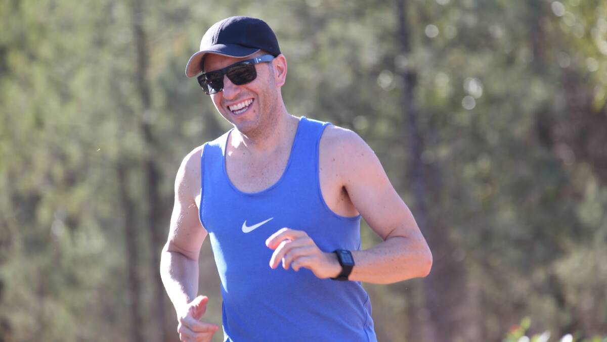 ALL SMILES: Rodney Savage makes his way around the Feral Joggers course at Scenic Hill last weekend. PHOTO: Anthony Stipo