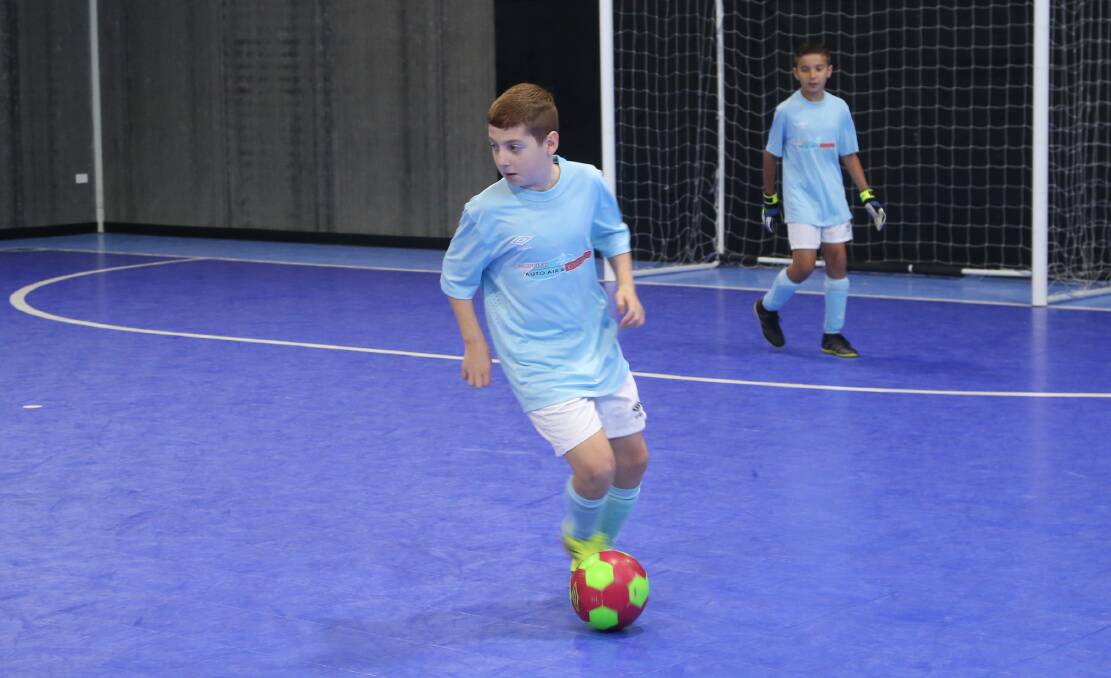 OPTIONS: Griffith Auto Air's Miles Guidolin looks up field during his side's futsal match against Barcamadrid in under 10s. PHOTO: Anthony Stipo