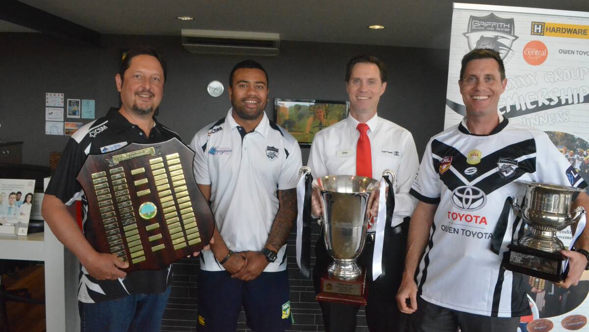 GIVING BACK: Black and Whites' committee member Chris Velis and co-coach Andrew Lavaka with Owen Toyota's Dean and Mark Owen. PHOTO: Liam Warren