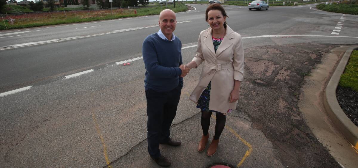 Safety upgrade: Local Ministers Adrian Piccoli and Susan Ley at the infamous Yoogali intersection that has secured funding for an upgrade. Picture: Anthony Stipo