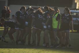 The Black and Whites celebrate after a nail-biting finish to their women's tackle clash with the Hay Magpies. Picture by Liam Warren