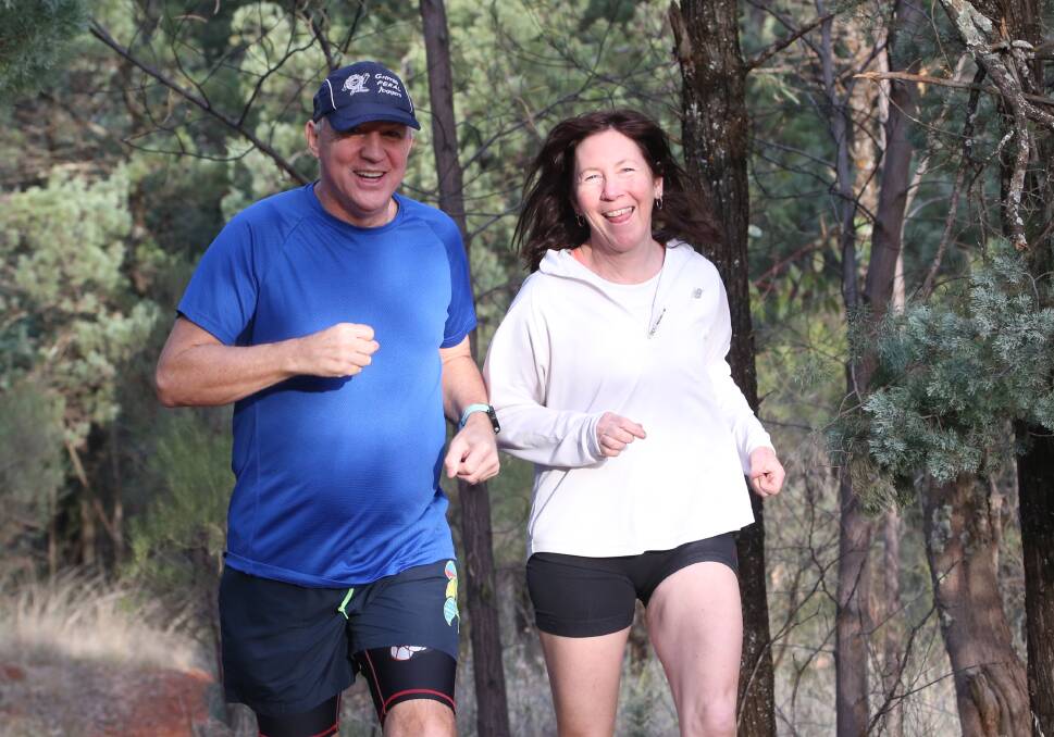 RUNNING THE CIRCUIT: John Dodd and Wendy Minato make their way around the joggers track around Scenic Hill over the weekend. PHOTO: Anthony Stipo 