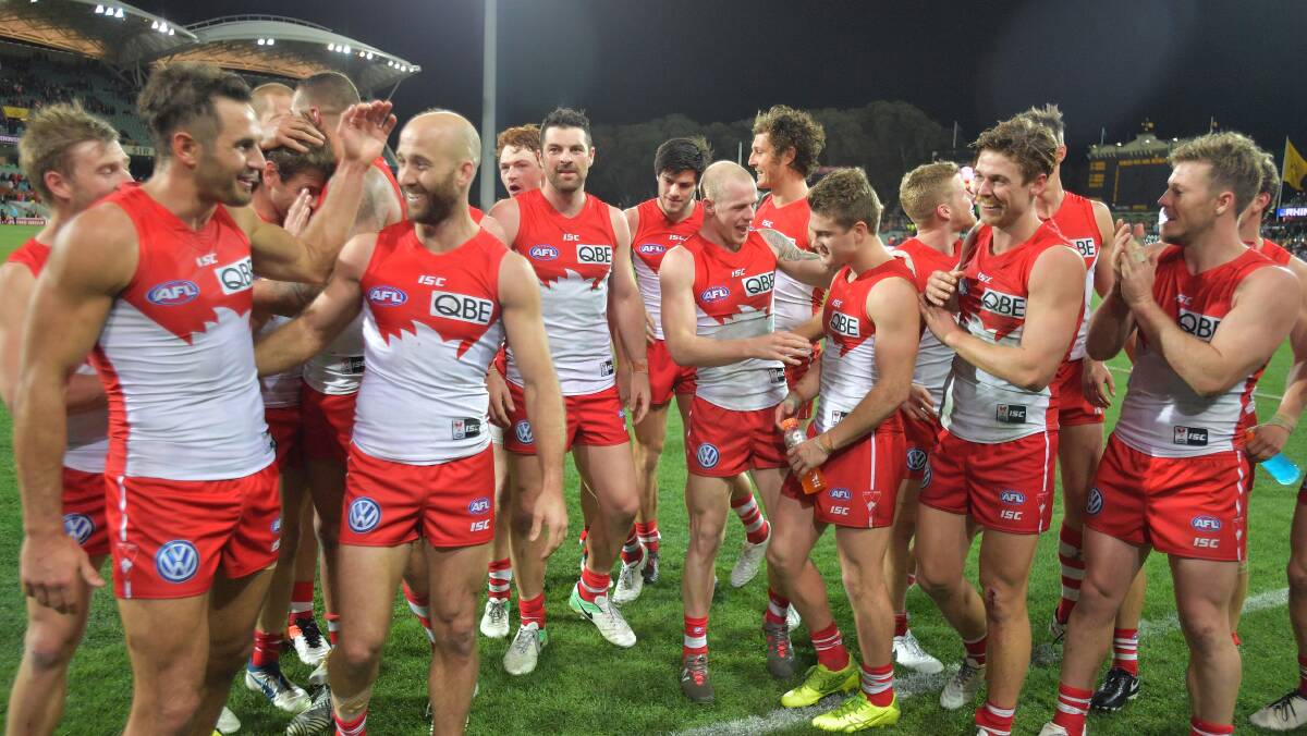 WINNERS: Swans players after the Round 22 AFL match between the Adelaide Crows at the Adelaide Oval on Friday night. PHOTO: AAP Image/David Mariuz