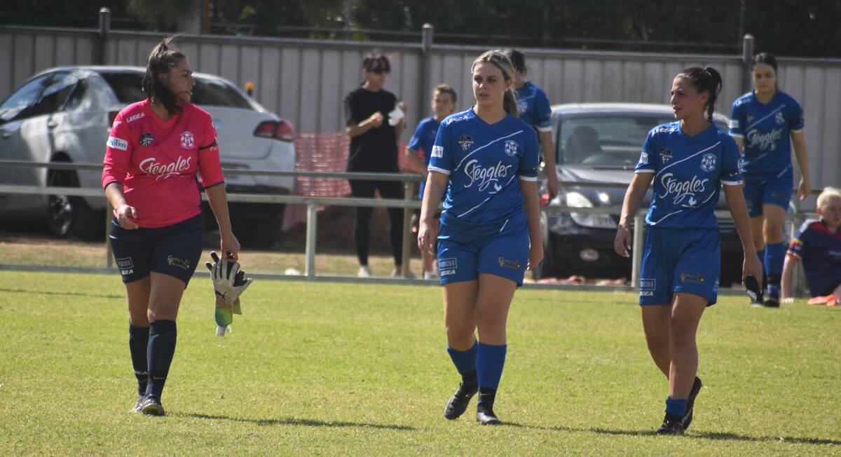 Maree Cirillo, Imogen Zuccato and Sophia Zappala come from the field after Hanwood's clash with CSU was called off after 20 minutes due to injury. Picture by Liam Warren