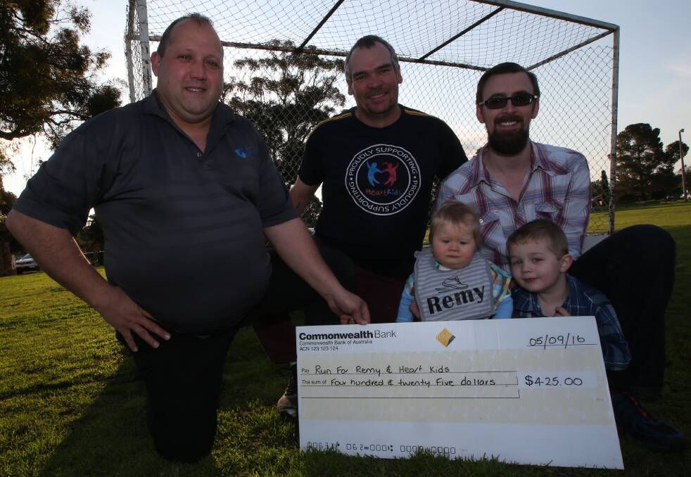 Griffith Hockey Association hands over a cheque valued at $425 dollars for both Run for Remy and Heart for Kids. Picture: Anthony Stipo