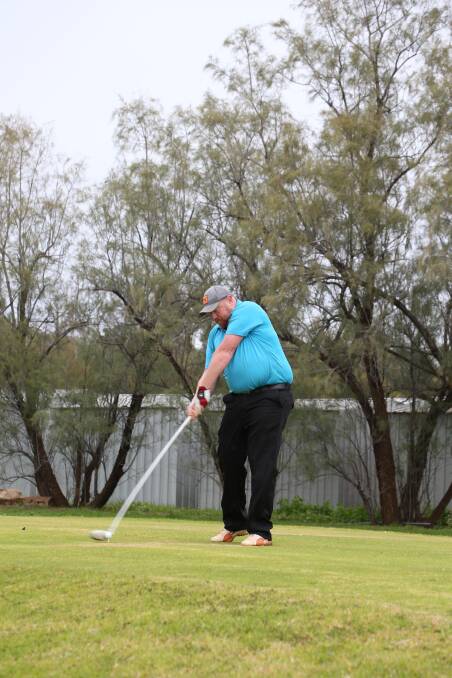 BOY IN BLUE: Keen golfer Adrian Smith lines up a swing at the Griffith golf club at the weekend. Picture: Anthony Stipo