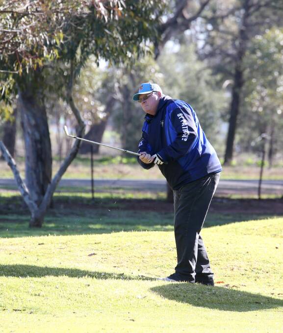 IN FOCUS: Keen golfer Dave Curry takes a swing at the Griffith golf club recently. Picture: Anthony Stipo