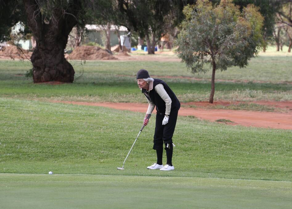 FOLLOWING THROUGH: Jenni Fisher sends the ball toward the hole at the Griffith Golf Club at the weekend. Picture: Anthony Stipo
