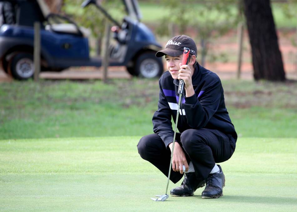 LOOKING FORWARD: Jake Harrison watches the ball at the Griffith Golf Club at the weekend. Picture: Anthony Stipo