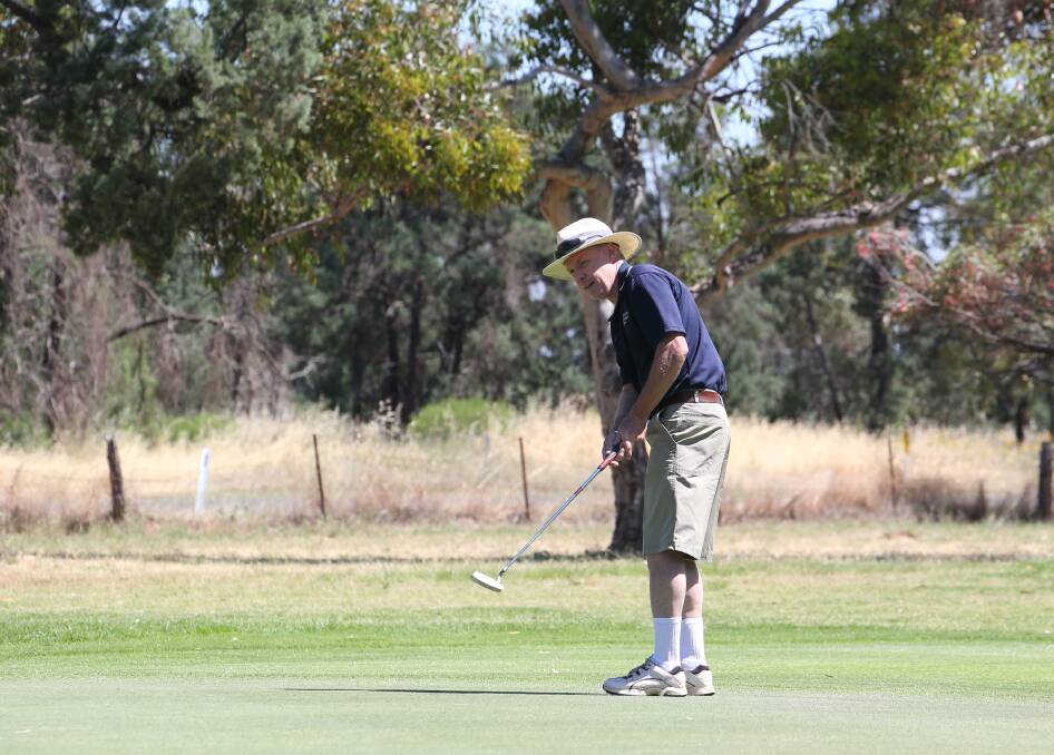 SPRINGTIME GOLF: Colin Leeson aims for the hole at the Griffith Golf Club at the weekend. Picture: Anthony Stipo