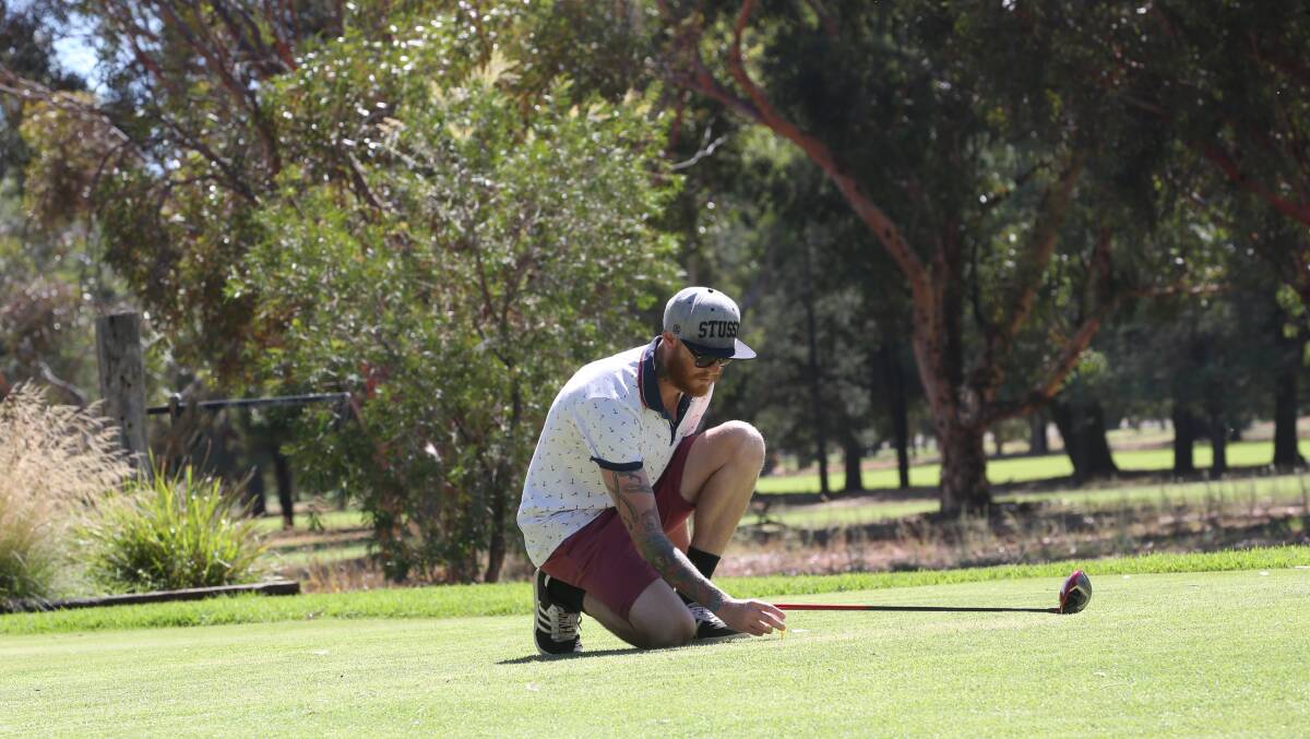 DOING THE MATHS: Lucas Kidd lines up his shot at the weekend at the Griffith Golf Club. Picture: Anthony Stipo