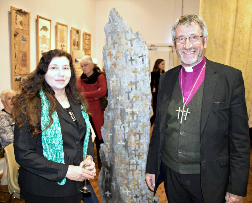 ART AND HISTORY: Aboriginal artist Treahna Hamm with Reverend Rob Gillion in front of Allan McKenzies' art piece We Have A Voice. Pictures: Contributed