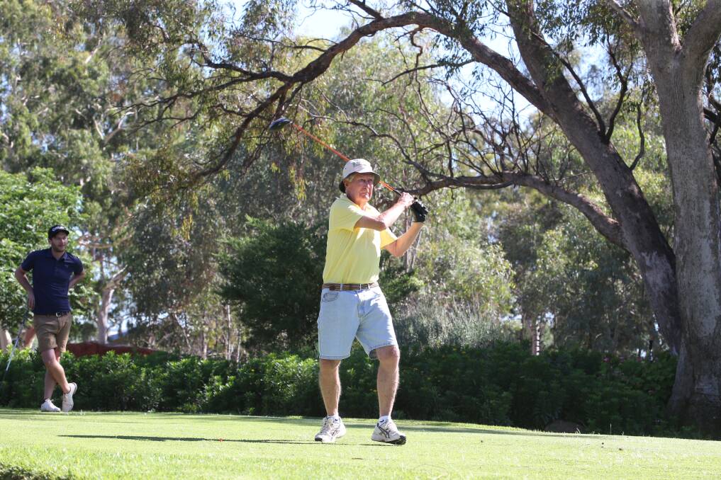 MELLOW YELLOW: Mick Carnell sends his ball down the fairway at Griffith Golf Club at the weekend. Picture: Anthony Stipo