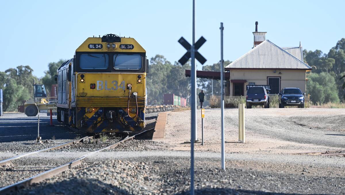 A freight train heads south from Tocumwal. Murray MP Helen Dalton would like the line north to Narrandera reopened to allow for produce to be moved to Melbourne. Picture by Mark Jesser