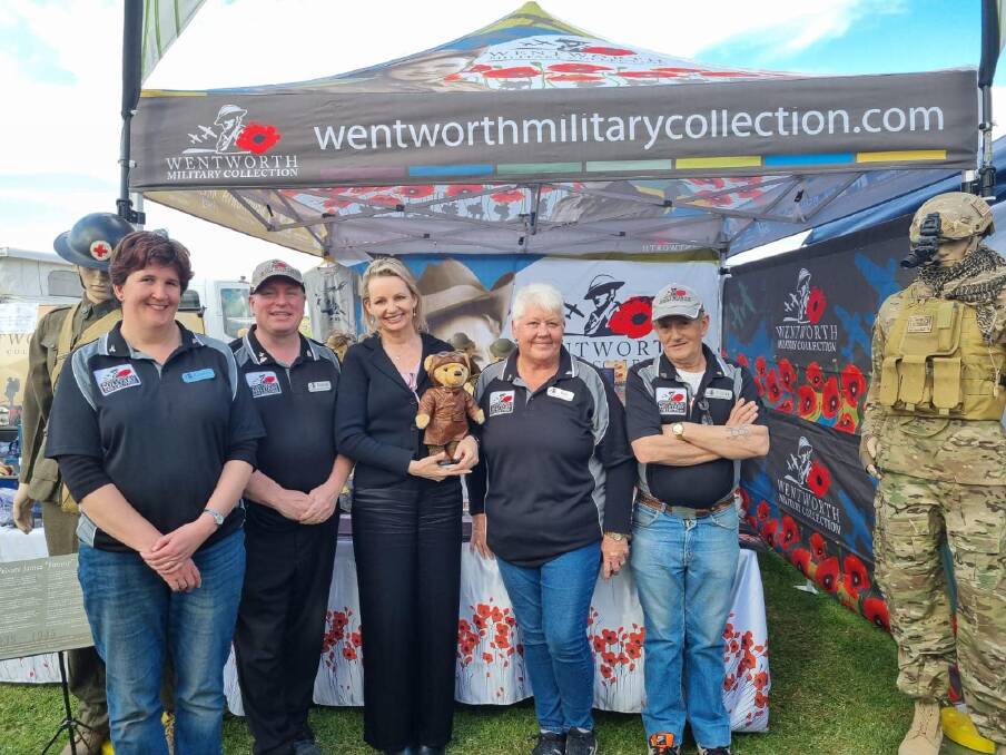 Sussan Ley holding a teddy bear at the Wentworth Show at a stand marking the town's military history. The MP spent over $5000 on a return trip to the event. Picture from Facebook