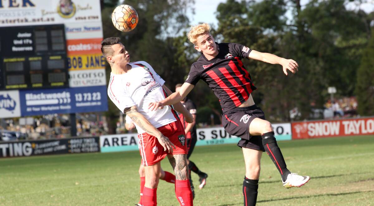 LEETON TAKE FLIGHT: Deon Peato and Salvatore Amato vie for possession in their tight encounter. Picture: Anthony Stipo.