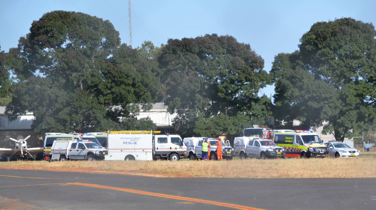 STANDBY: Emergency services respond to reports of a plane with no landing gear at Griffith airport on Monday. Picture: Riley Krause.
