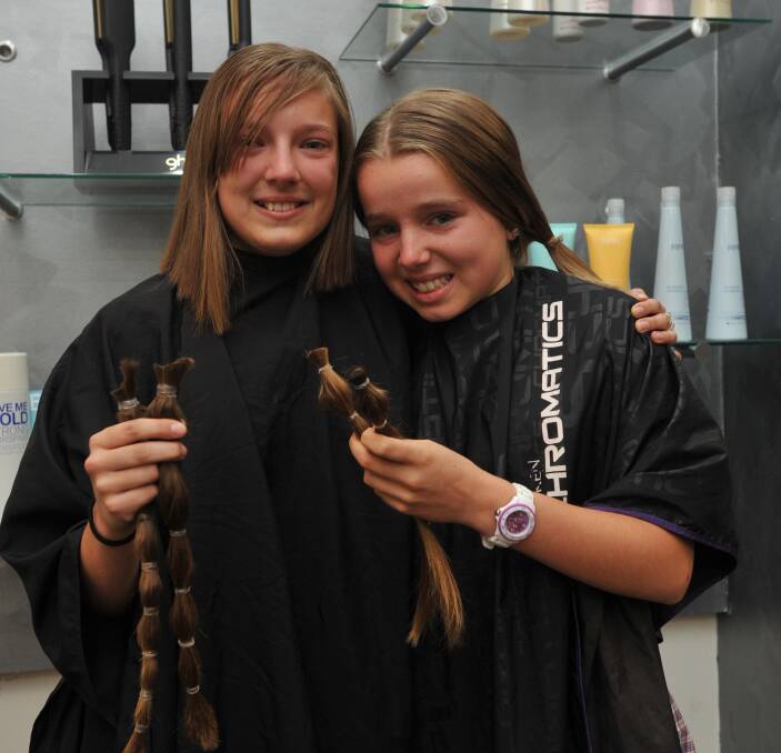 BRAVE: Friends Nicole Bruss and Ruby Zandona donate their hair to make wigs for cancer patients. 
Picture: Anthony Stipo
