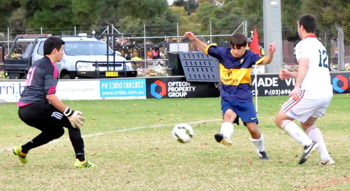 CLINICAL: Yoogali SC's Isaac Brooker scoring his team's fifth goal of the day in their match against Griffith City. Picture: Wendy Simpkin.