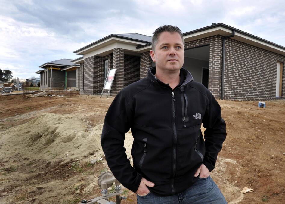 TREE CHANGE: Brendon Jones inspecting his new home on Tuesday, which he'll soon move into to escape the Sydney 'madhouse'. Picture: Les Smith.