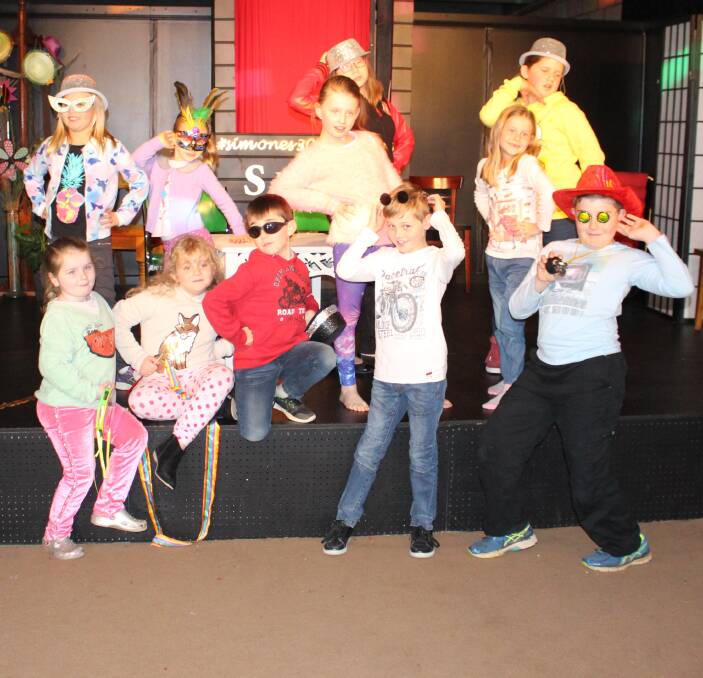 UP AND ABOUT: The group of 11 kids got all dressed up on Tuesday for their drama workshop before striking a pose for the camera. Picture: Riley Krause.