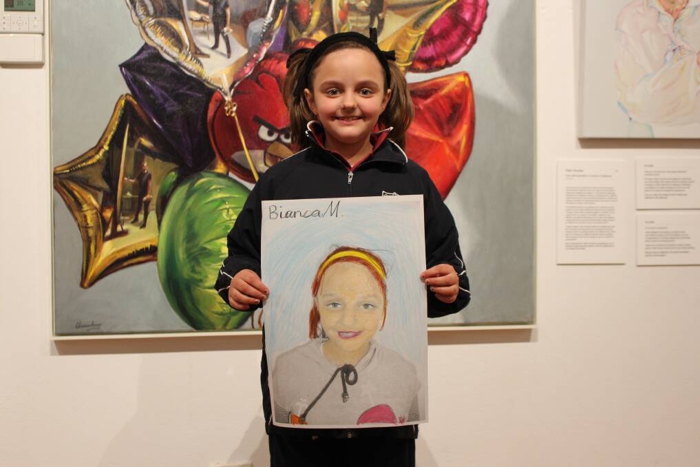 SPITTING IMAGE: Bianca Matkovic, 8, from St Mary's primary school shows off her entry for the Young Archie competition. Picture: Riley Krause.