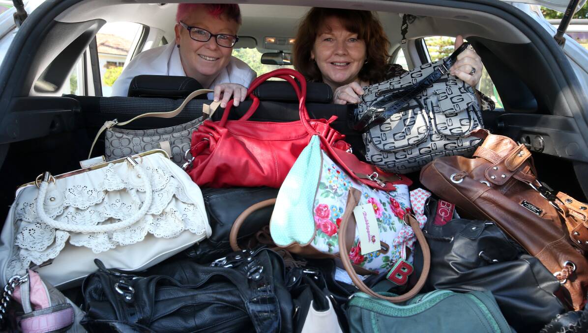GENEROSITY: Lexi King and Carrol Farlow are over the moon with all the handbags that have been donated so far. Picture: Anthony Stipo.