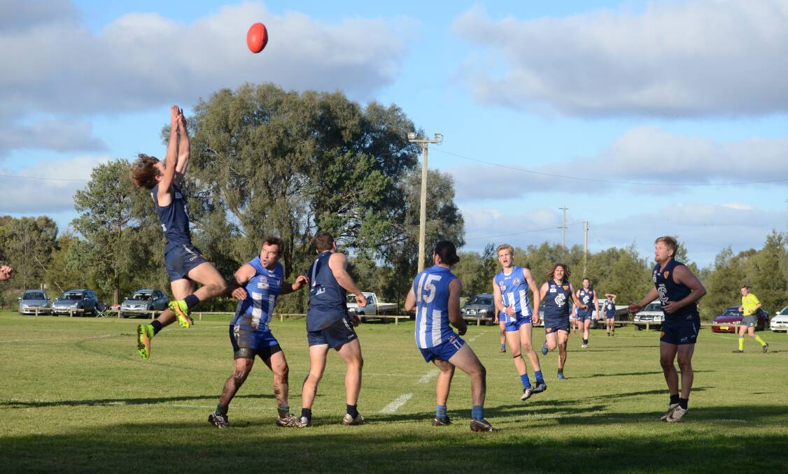HITTING GREAT HEIGHTS: Coleambally's Jacob Breed flies for a mark during the Blues' win over Temora on Saturday. Picture: Riley Krause 
