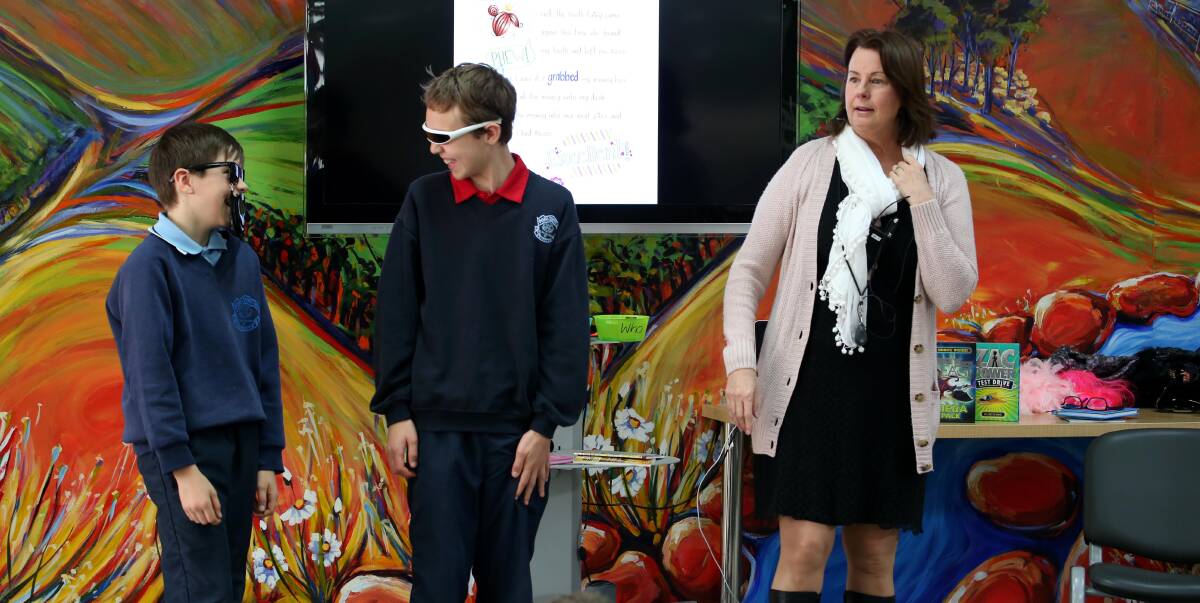 BOOK WEEK: St Pats students Jaden Zandona and Hatt Laurent with author Louise Park. 
Picture: Anthony Stipo
