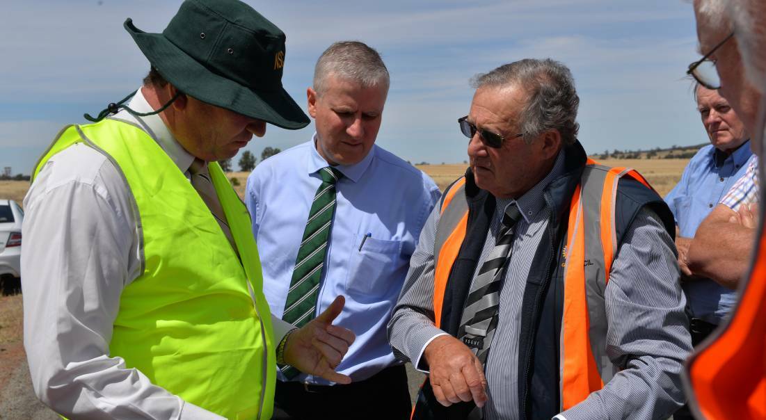 WORTH EXPLORING: Barnaby Joyce reviews plans for a dam at Lake Coolah with Michael McCormack and mayor John Dal Broi in November.