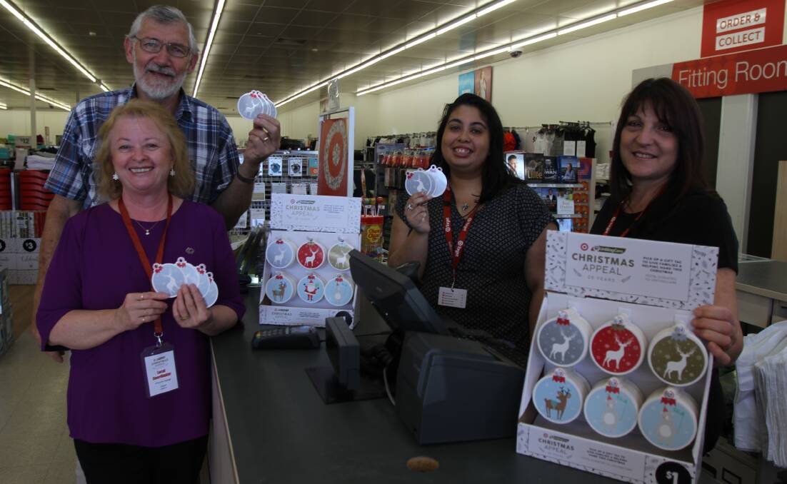 HELP: Co-ordinator Priscilla Hester and mayor Paul Maytom with Target Leeton's Jess Lipton and Carmel Nardi displaying the gift tags that can be purchased.