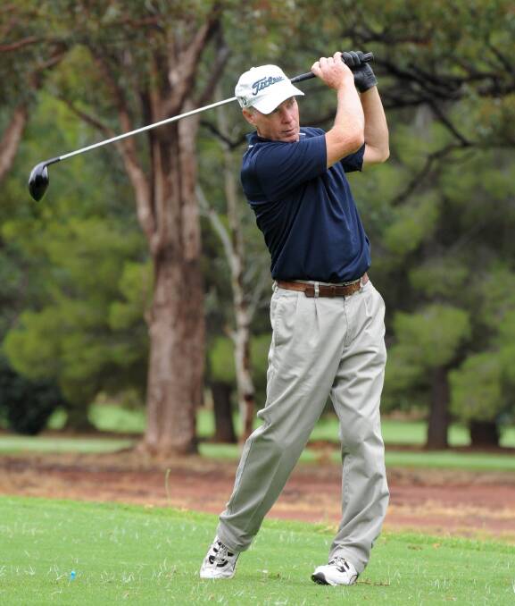 GOOD FORM: Colin Leeson looks down the fairway after striking his shot at Griffith Golf Club. Pictures: Anthony Stipo