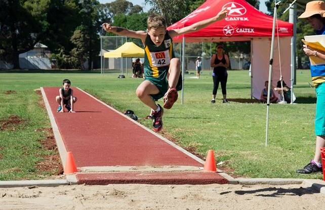 AIR TIME: Griffith Little Athletics member Jake Fattore tests his long jump skills at West End Oval. Picture: Supplied