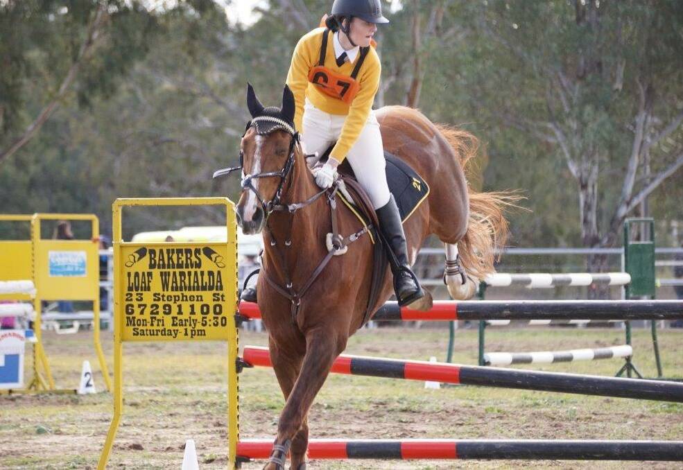 RIDING HIGH: Griffith's Lydia Hanna at the state showjumping championships. Picture: Supplied