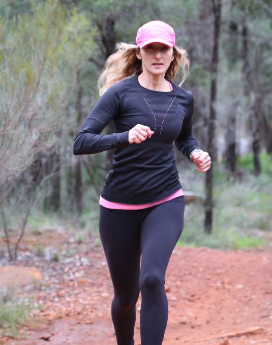 STRIDING OUT: Lena Sergi takes part in race six of the Surfer competition with the Griffith Feral Joggers at Scenic Hill. Picture: Anthony Stipo